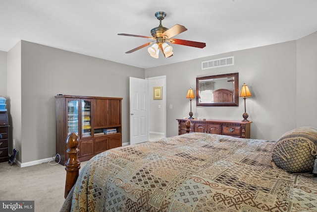 bedroom featuring a ceiling fan, baseboards, visible vents, and carpet floors