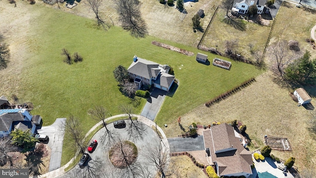 birds eye view of property with a residential view