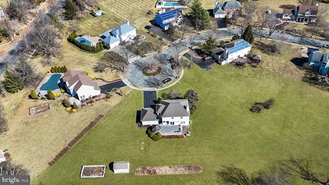 birds eye view of property with a residential view