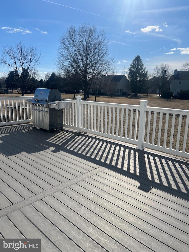 wooden deck with grilling area