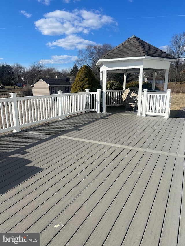 wooden deck with a gazebo