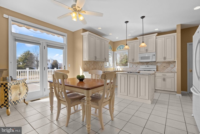 dining space featuring light tile patterned floors, recessed lighting, and ceiling fan