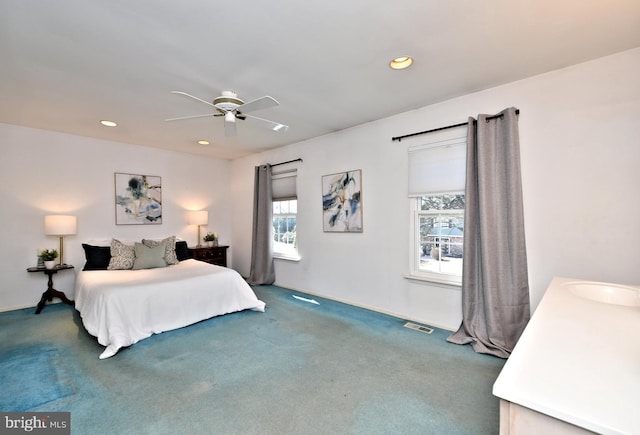 bedroom with recessed lighting, carpet floors, a sink, a ceiling fan, and visible vents