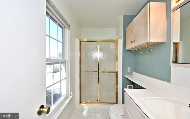 full bathroom featuring decorative backsplash, toilet, a shower stall, vanity, and tile patterned flooring