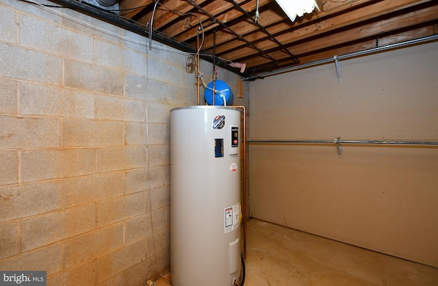 utility room with electric water heater