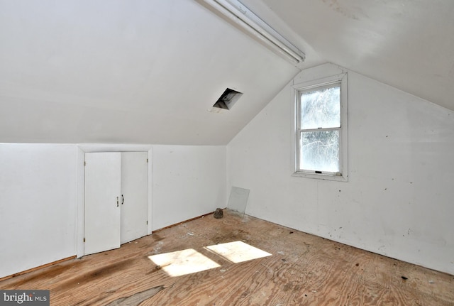 additional living space with vaulted ceiling