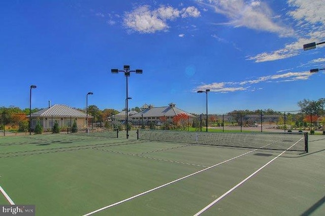 view of sport court featuring fence