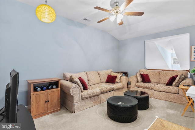 living area featuring visible vents, lofted ceiling, light colored carpet, and ceiling fan