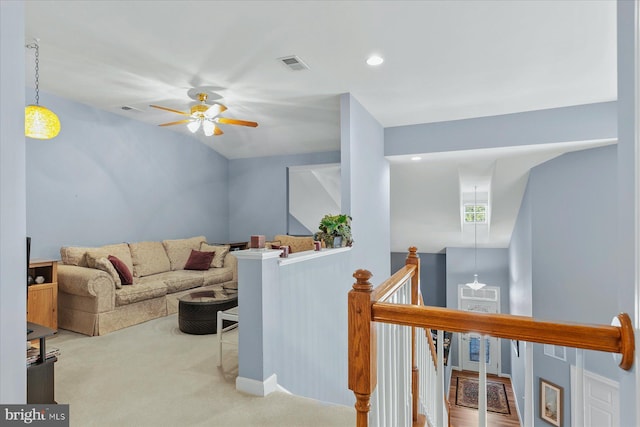 carpeted living room with recessed lighting, visible vents, and a ceiling fan