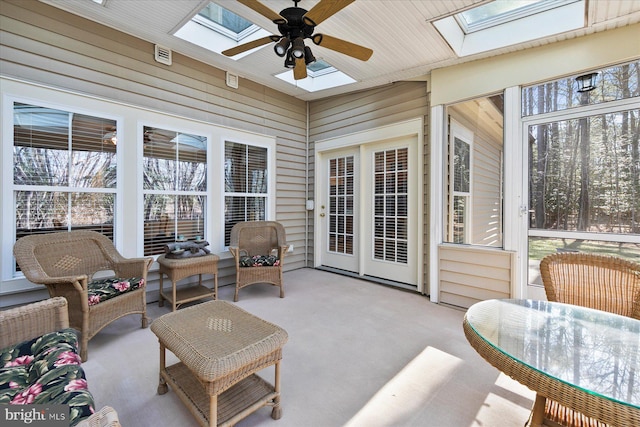 sunroom / solarium with a skylight, plenty of natural light, and ceiling fan