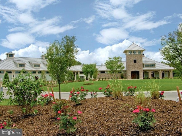 view of home's community featuring a lawn