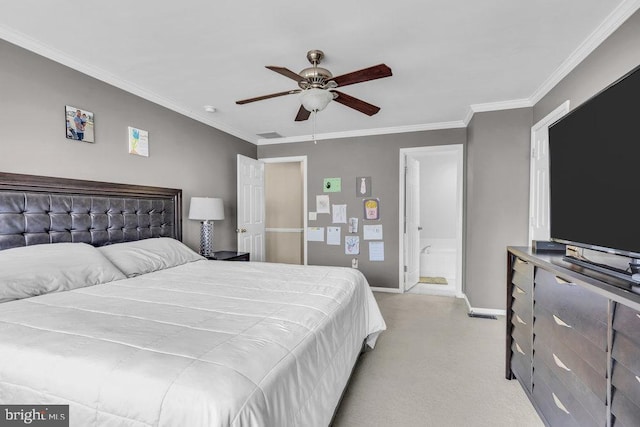 bedroom featuring connected bathroom, a ceiling fan, baseboards, and ornamental molding