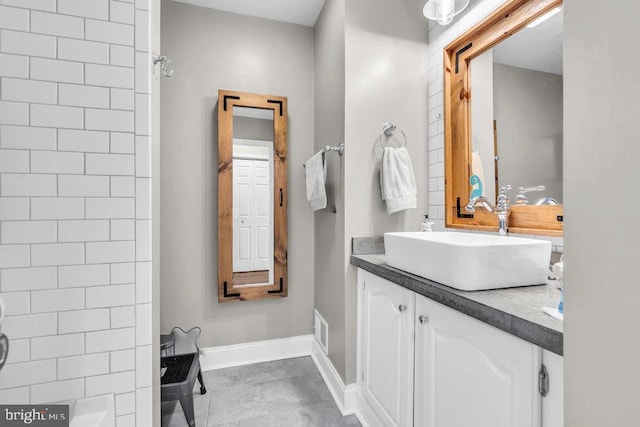 full bath with visible vents, baseboards, shower / bath combination, and vanity