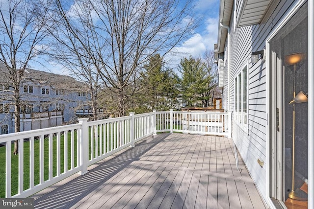 wooden terrace with a residential view