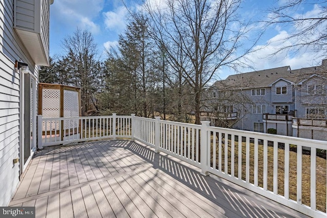 wooden deck featuring a residential view