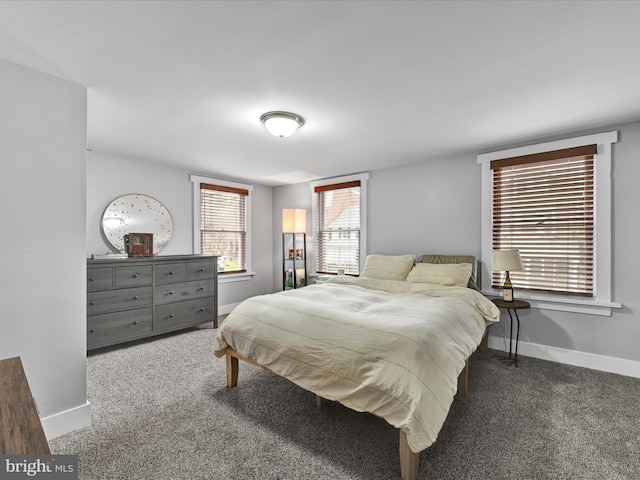 carpeted bedroom with baseboards