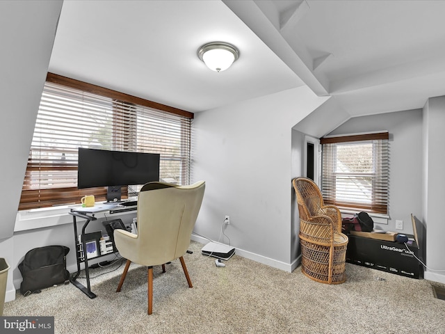 carpeted home office featuring visible vents and baseboards