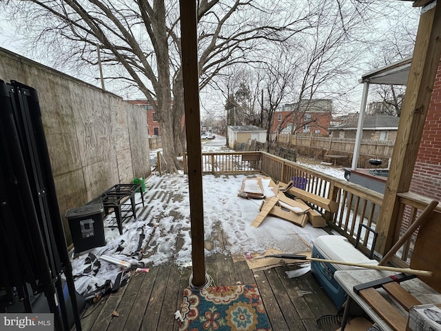 wooden deck featuring a fenced backyard