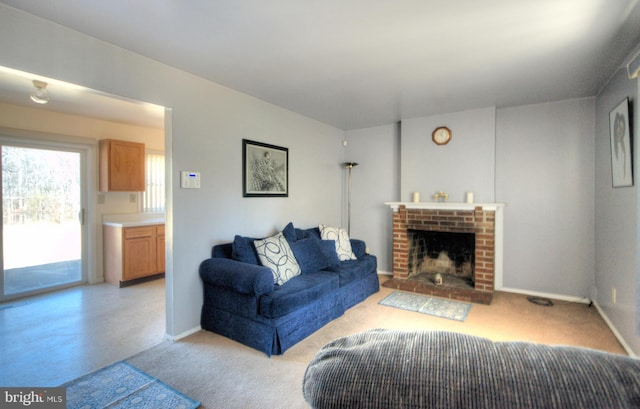 living room featuring light carpet, a brick fireplace, and baseboards