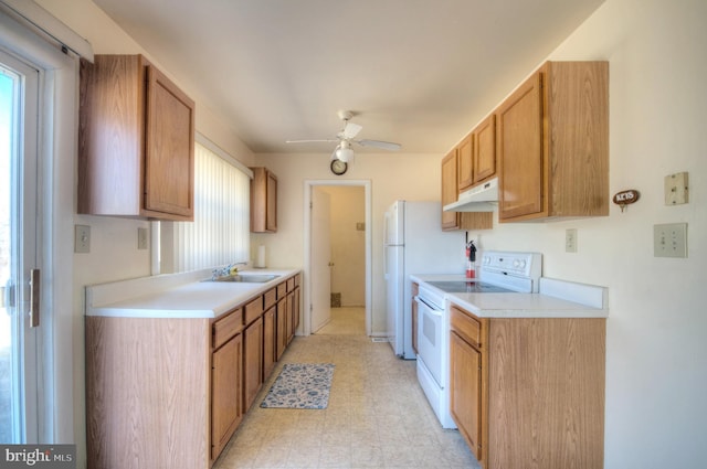 kitchen with white electric range oven, light floors, ceiling fan, light countertops, and under cabinet range hood