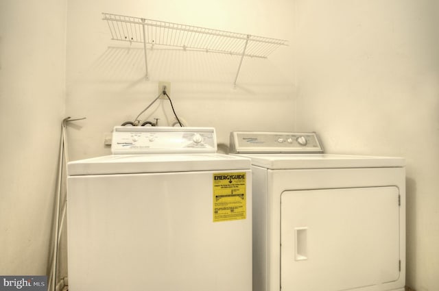 laundry room featuring washer and clothes dryer and laundry area