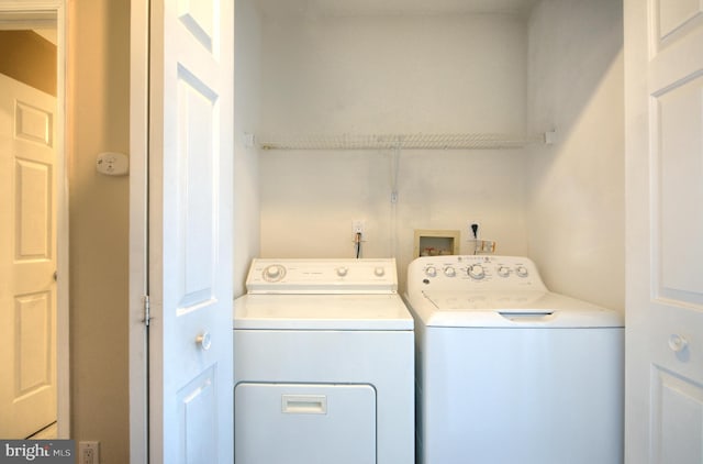 laundry room featuring laundry area and washing machine and clothes dryer