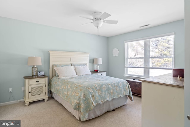 bedroom with ceiling fan, baseboards, visible vents, and light carpet