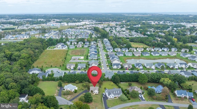 birds eye view of property with a residential view and a water view