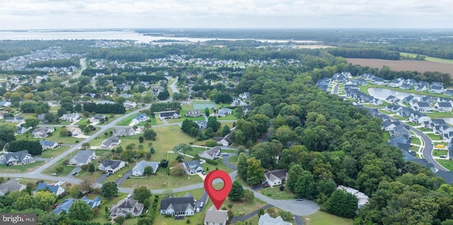 birds eye view of property featuring a water view and a residential view