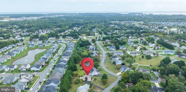 drone / aerial view featuring a residential view and a water view