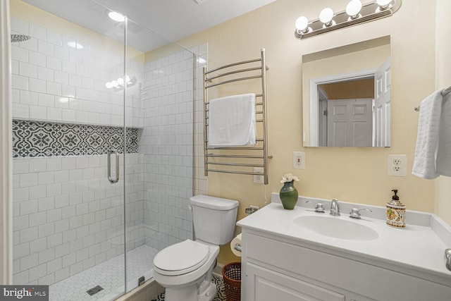 bathroom with toilet, a stall shower, radiator, and vanity