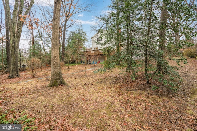 view of yard with a wooden deck