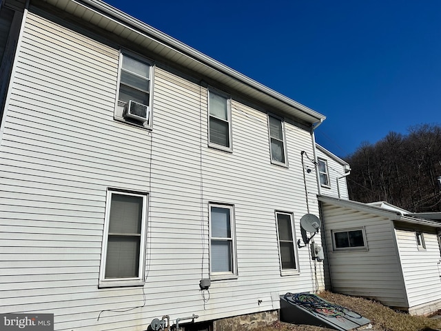 view of property exterior with cooling unit