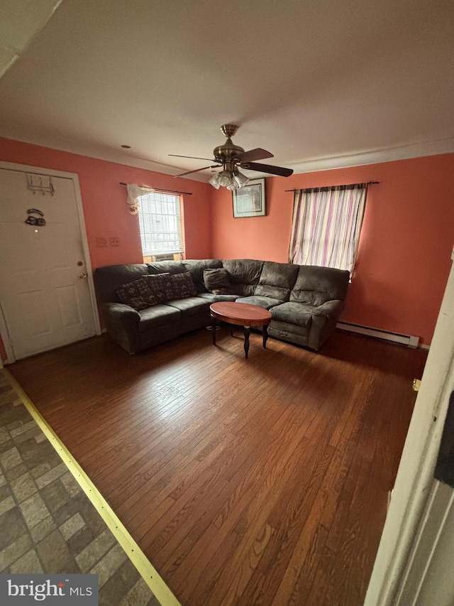 living room with hardwood / wood-style flooring, a baseboard radiator, and ceiling fan