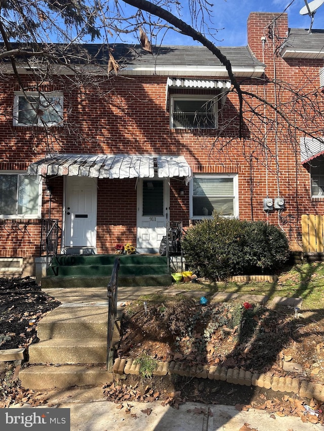 view of property featuring brick siding