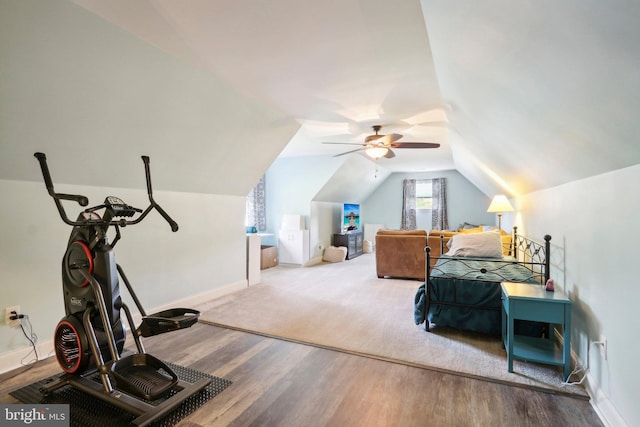 bedroom featuring lofted ceiling, ceiling fan, baseboards, and wood finished floors