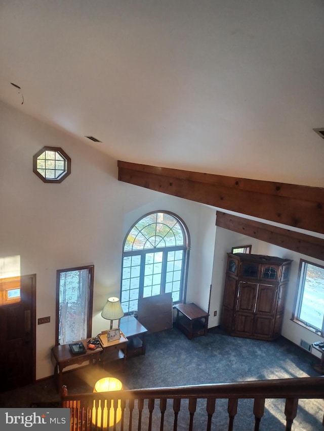 living room featuring vaulted ceiling and carpet flooring