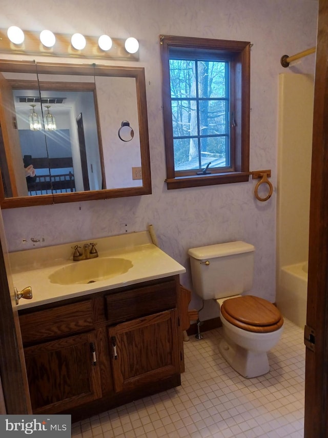 full bathroom featuring vanity and toilet