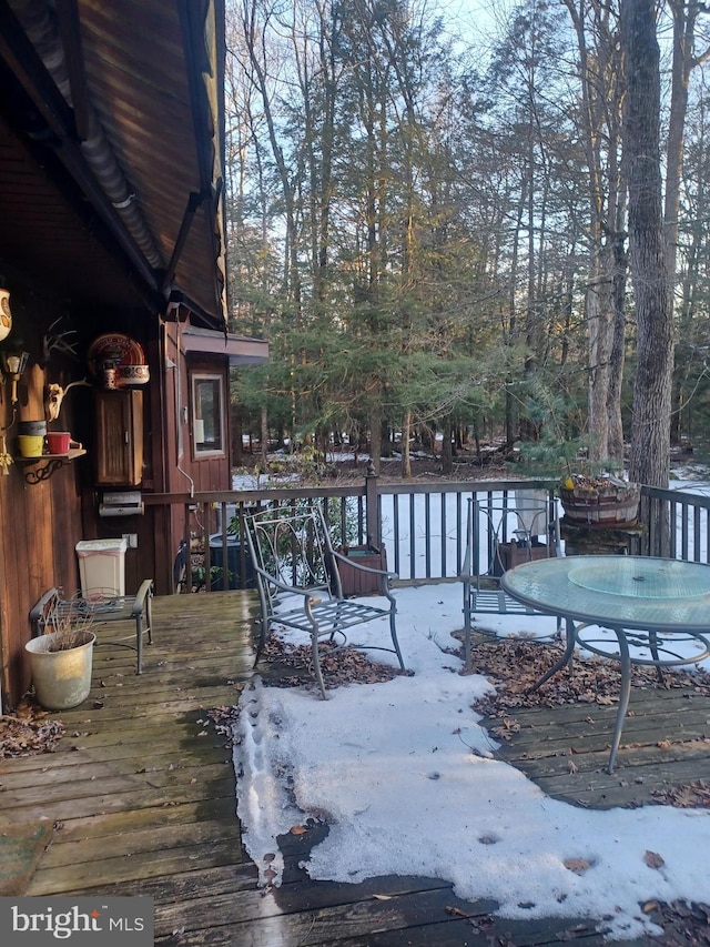 wooden deck with outdoor dining area