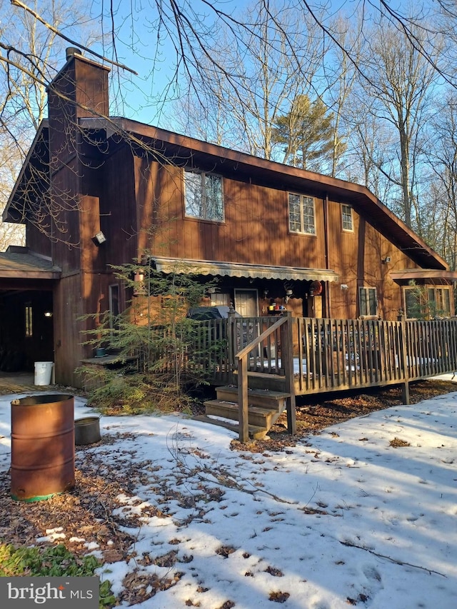 view of front of home featuring a chimney