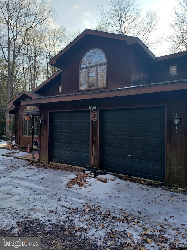 view of snow covered garage