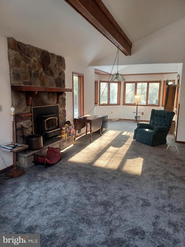 living area with carpet flooring, lofted ceiling with beams, and baseboards