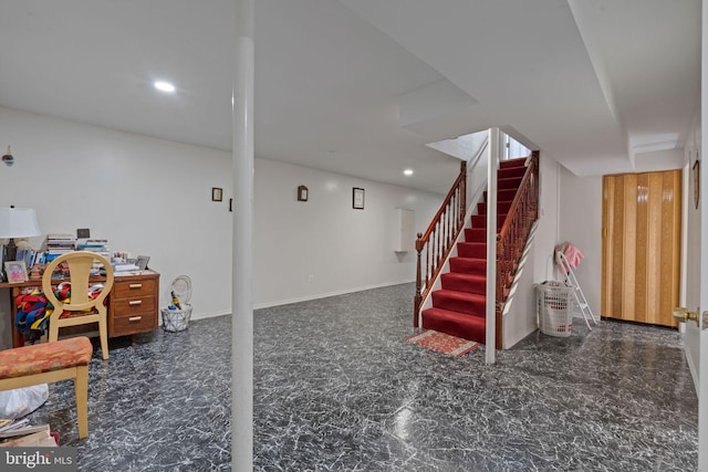 finished basement featuring recessed lighting, baseboards, and stairs