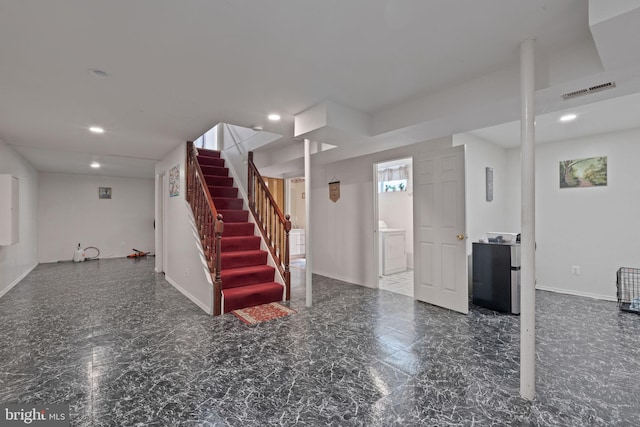 interior space with refrigerator, recessed lighting, stairway, washer / dryer, and baseboards