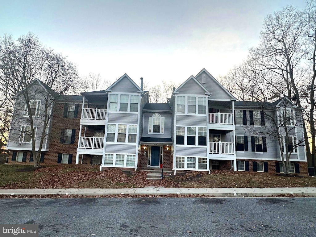 view of front of home with brick siding