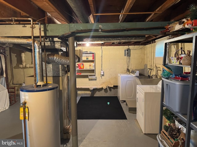 unfinished basement with gas water heater and washer and dryer