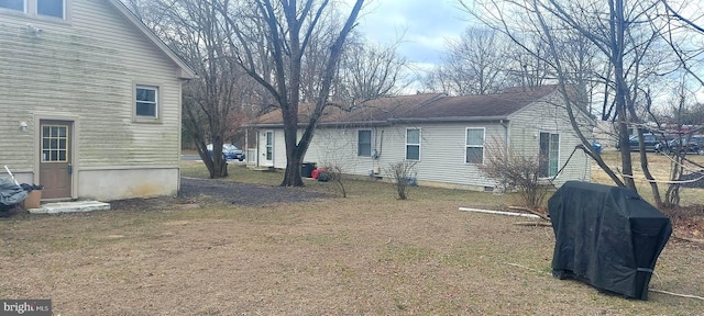 view of side of home featuring driveway