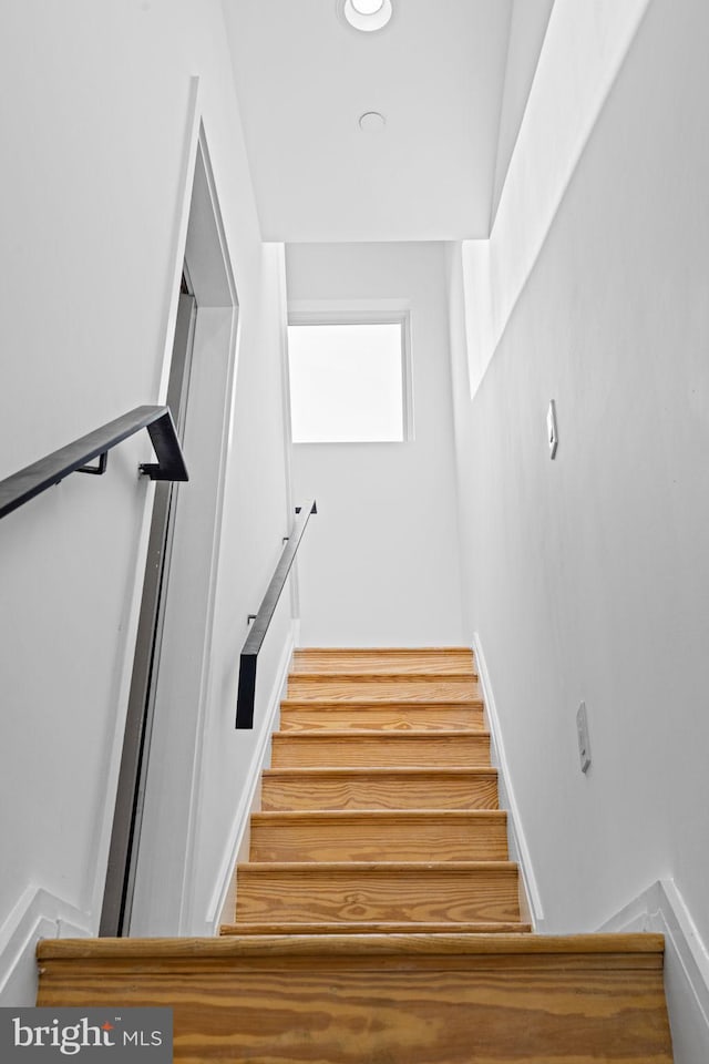 staircase with baseboards