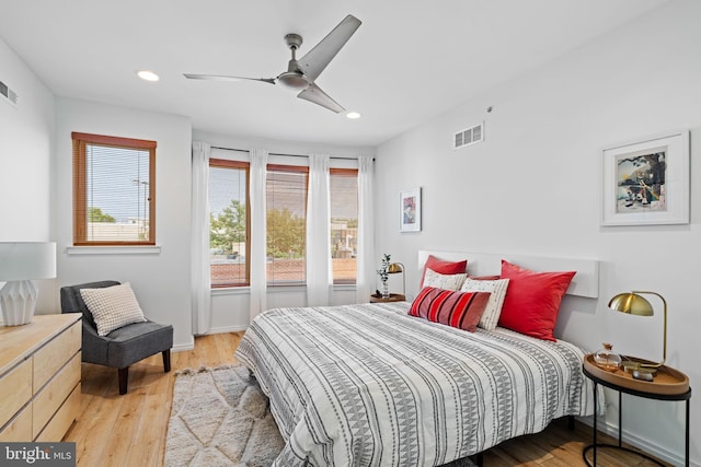 bedroom with visible vents, baseboards, light wood-style flooring, ceiling fan, and recessed lighting