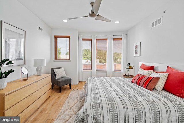 bedroom featuring ceiling fan, light wood finished floors, visible vents, and recessed lighting